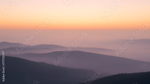Wallpaper Mural Layers of misty mountains fade into the horizon under a soft gradient sky, creating a serene and atmospheric landscape that evokes a sense of peace and distance Torontodigital.ca