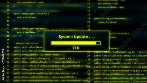 Yellow glowing progress bar shows 100% percent of system update on a background of computer code programming