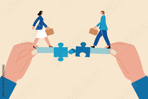 Two business people walking across a bridge made of puzzle pieces held by hands symbolizing teamwork and connection