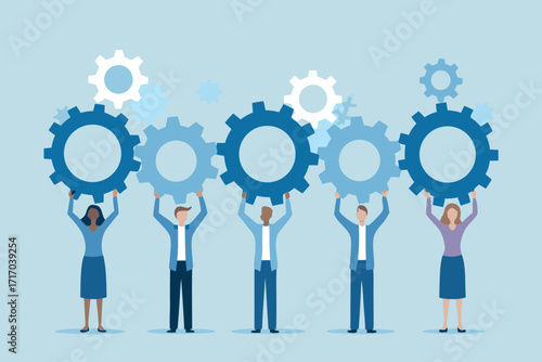 Diverse team of people holding up interconnected gears symbolizing collaboration and teamwork in business