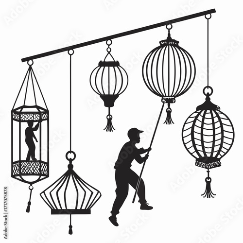 Silhouette of man adjusting hanging lanterns with figures inside