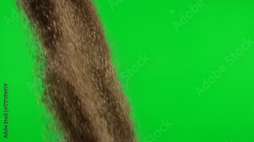 A large quantity of coarse brown sand pouring rapidly, creating a dynamic cascade, isolated on a solid green screen transition, large quantity of coarse brown sand, demolition