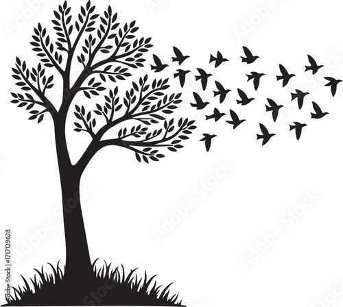 Black silhouette of a tree with leaves and flock of birds flying away