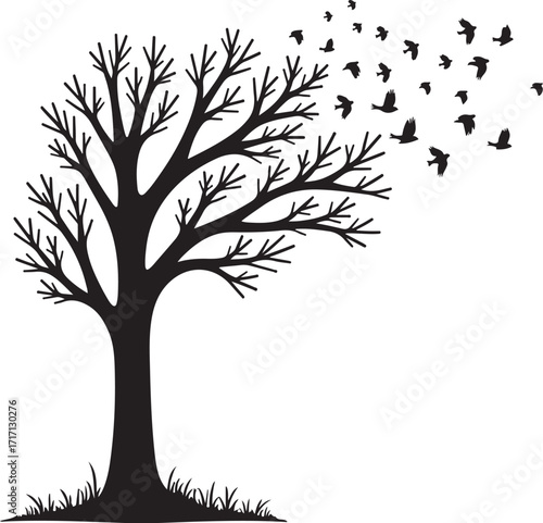Black silhouette of bare tree with flock of birds flying away