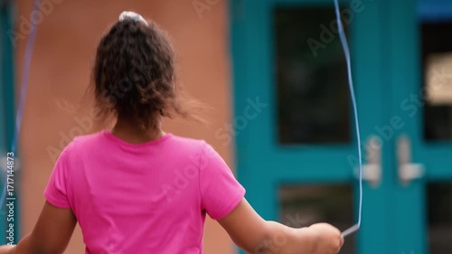 Young Girl Skipping Jump Rope