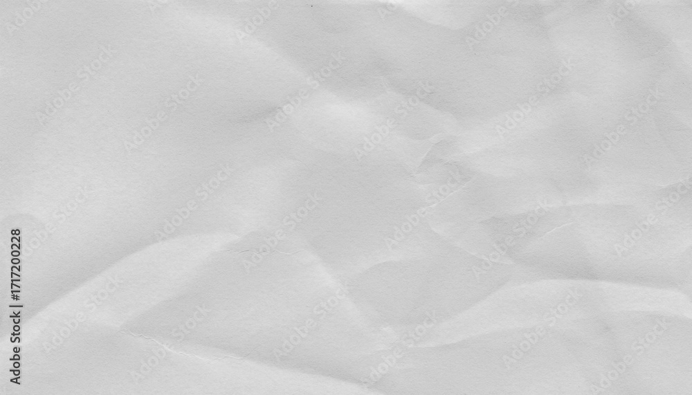 Fototapeta premium Crumpled white paper texture with visible creases and folds, ideal for backgrounds or design elements. surface shows subtle shadows and highlights, creating realistic and tactile appearance