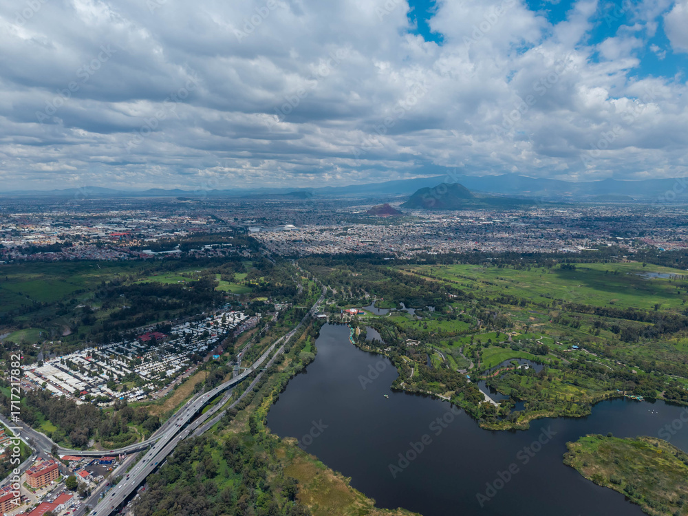 Obraz premium Aerial photograph of Xochimilco ecological zone in Mexico City, a day with clouds and a summer sun over wetlands to south of city