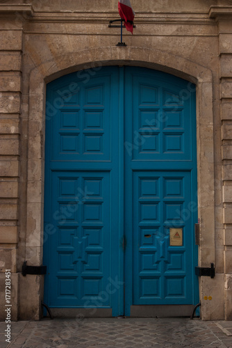 old wooden door in red brick wall