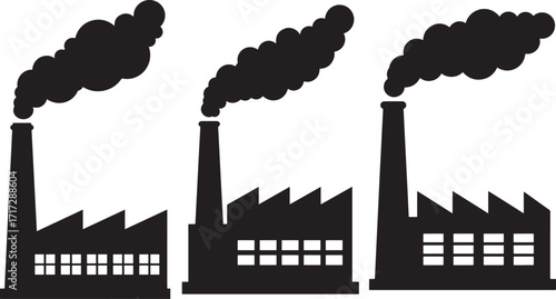 Three industrial factory buildings with smoke stacks silhouette
