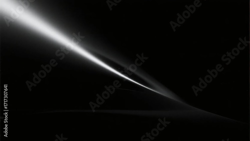 Abstract light beam cutting through darkness with smooth gradient and reflective surface