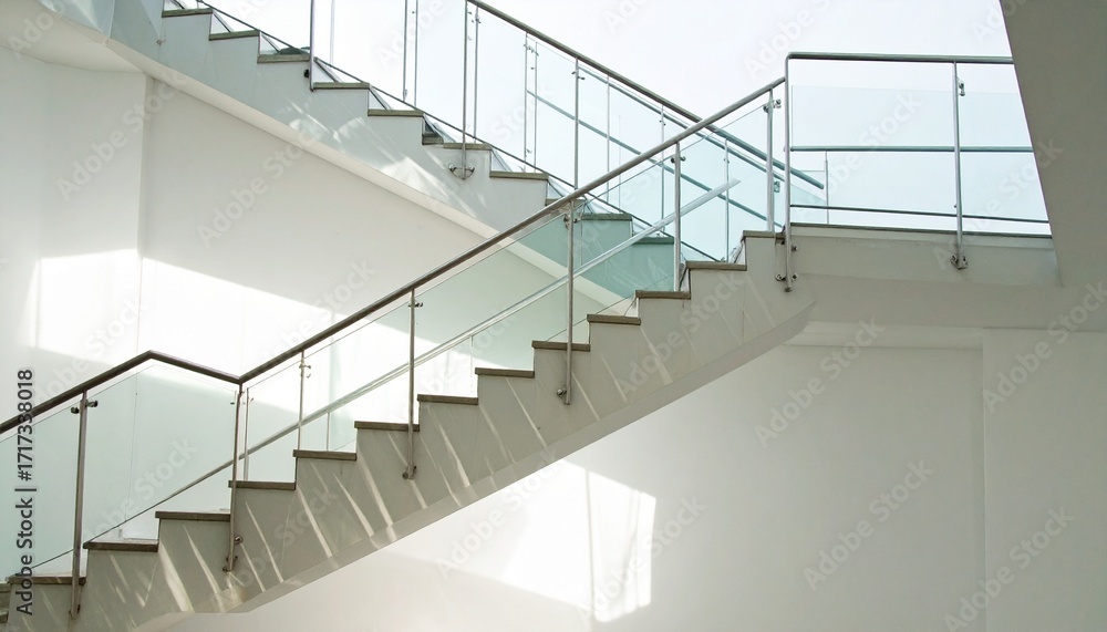 Obraz premium Modern Minimalist Staircase with Glass Railing and Sunlight
