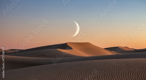 Wallpaper Mural Crescent moon shining over sandy dunes at sunset in desert landscape   Torontodigital.ca