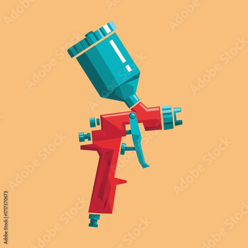 A red and teal spray gun is isolated on a peach colored background.