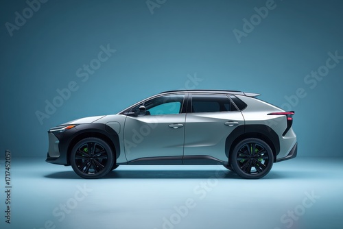Sleek Silver Crossover SUV with Bold Design Featuring Aerodynamic Lines and Dynamic Wheel Styling Under Soft Blue Lighting