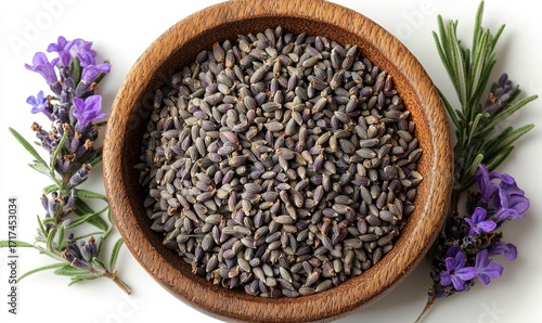 Dried lavender seeds in a wooden bowl, surrounded by fresh lavender flowers and rosemary