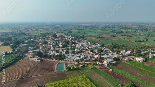 Scenic Indian Village Drone Aerial Footage in Ultra HD 4K Capturing Countryside Beauty, Green Fields, Traditional Homes, and Vibrant Culture