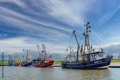 colourful fishing trawlers in the harbour of Dorum-Neufeld on Germany's Wadden Sea coast