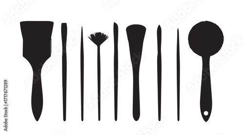 Collection of various art and beauty tools in a striking black silhouette
