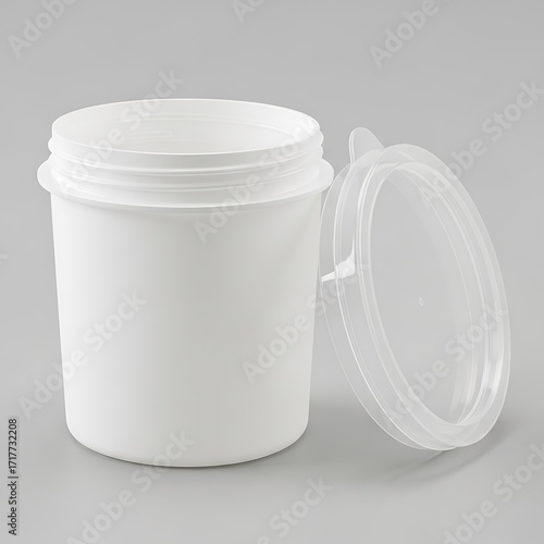 A cylindrical, white plastic container with a clear plastic lid, isolated against a neutral background.