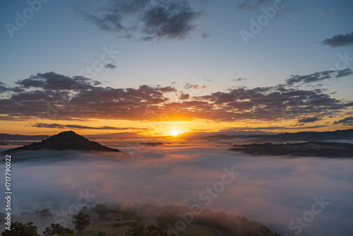 The most beautiful warm sunrise above auvergne montain with fog