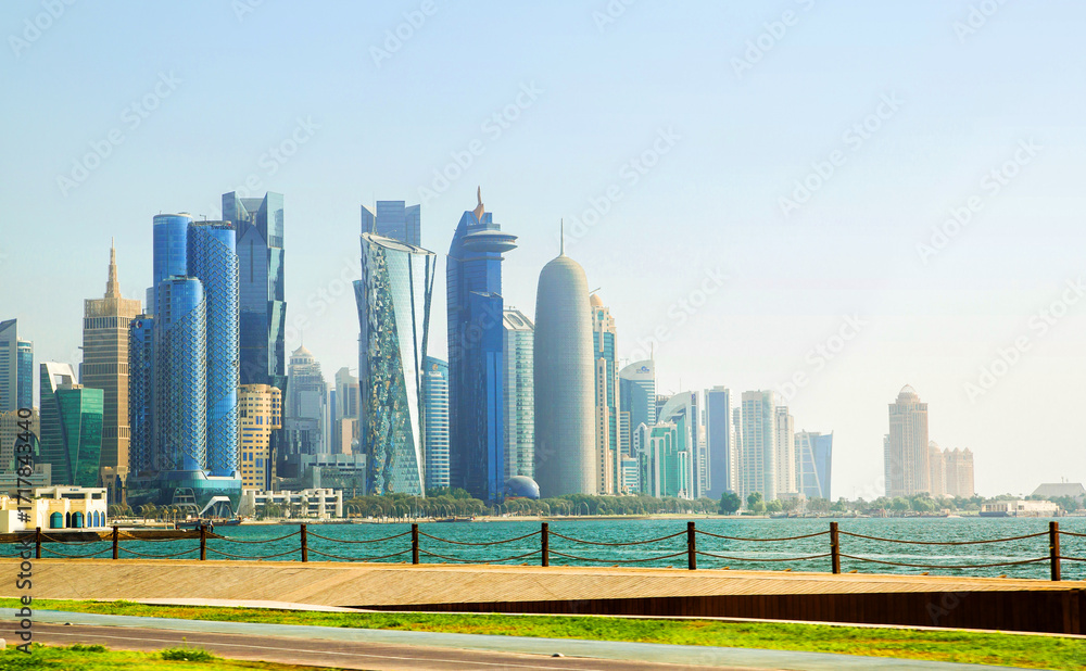 Fototapeta premium Panoramic view of Doha city, modern skyscrapers and Persian Gulf. Qatar, Middle East 