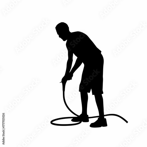 Silhouette of worker bending to connect power cable on machine isolated on white background