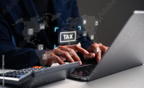 A person using a laptop with a digital tax interface displayed, surrounded by a global map and financial icons, emphasizing modern financial management.