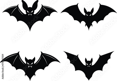 Four spooky silhouetted bats flying with open wings ready for halloween night