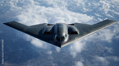 B-2 spirit stealth bomber flying above clouds during daytime operations