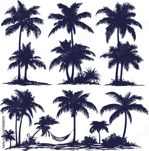 Tropical palms silhouette against a vibrant sunset sky on a secluded beach