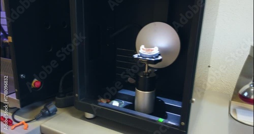 Professional dental machine carving out artificial teeth