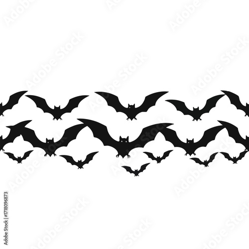 A seamless horizontal border of black flying bat silhouettes for a spooky Halloween theme.