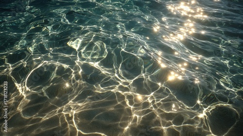 Sunlit Ripples on Teal Water Surface, Sandy Bottom Visible
