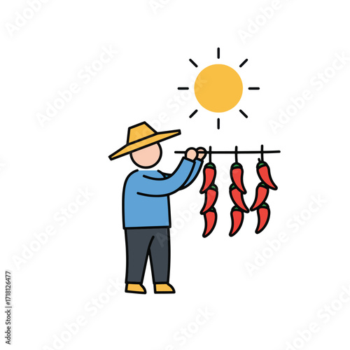 Farmer drying red chili peppers under the sun.