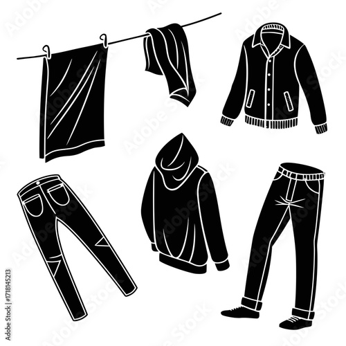 Assortment of clothing items on a clothesline and laid out
