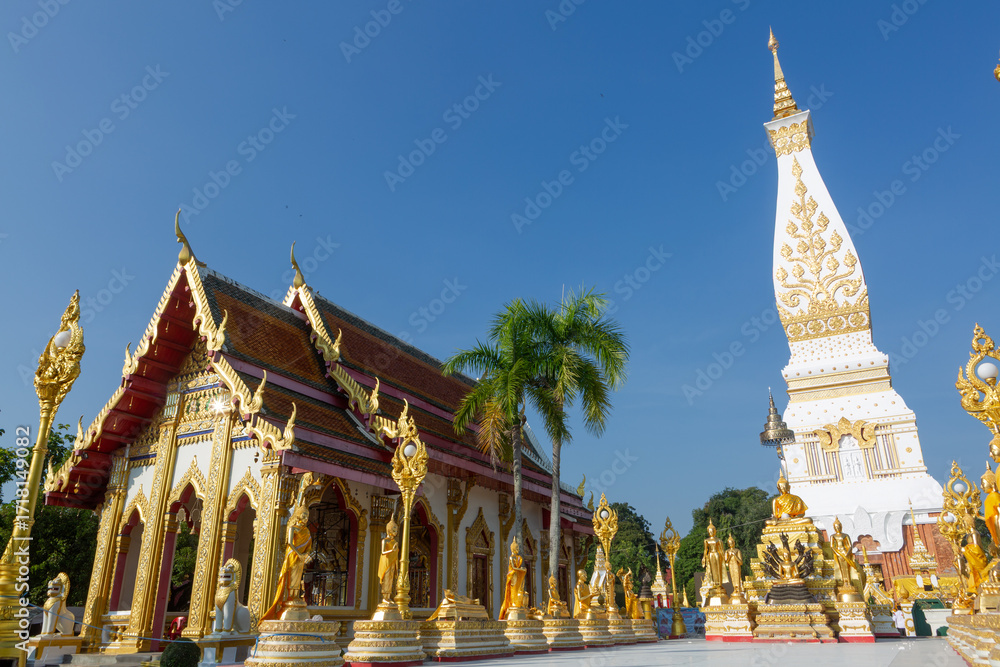 Fototapeta premium The golden pagoda of Wat Phra That Phanom, a beautiful Buddhist architectural landmark in Nakhon Phanom Province, Thailand.