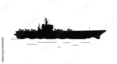 A sleek silhouette of a naval aircraft carrier on calm water