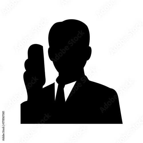 Silhouette of a businessman using a smartphone or mobile device to communicate