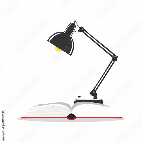 A black articulated desk lamp shines its light onto an open red book, isolated on a white background.