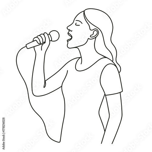 Young woman singing into microphone with passion and energy  