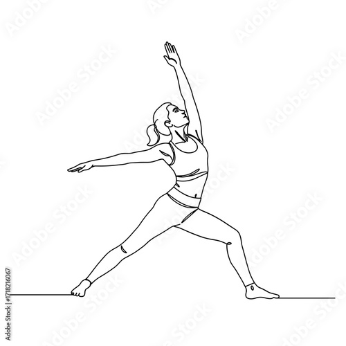 Young woman practicing yoga in warrior pose on plain background  