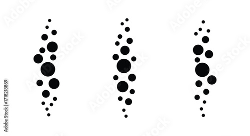 Abstract pattern of black circles arranged in vertical uneven columns