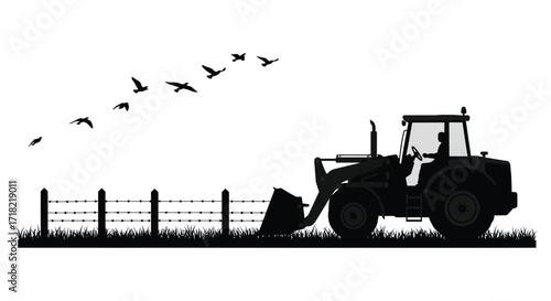 A tractor with a front loader and birds flying in the sky
