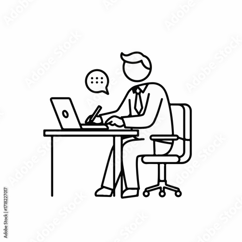 Focused businessman working diligently at his desk on a laptop, symbolizing productivity and concentration.