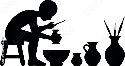 Black silhouette of person making pottery craft hobby