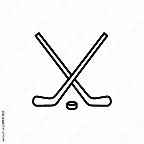 Iconic crossed hockey sticks and puck symbolize winter sport and competition