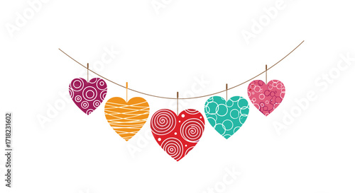 Colorful heart shapes hanging on a string.