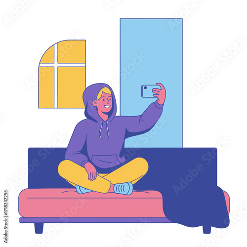 Young man taking a selfie on a couch at home.