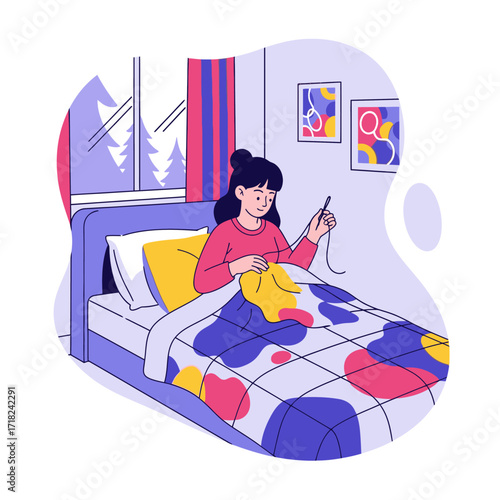 A young woman is seated in bed, sewing a colorful quilt.