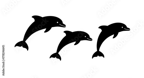 Dynamic silhouettes of three playful dolphins leaping joyfully above the waves